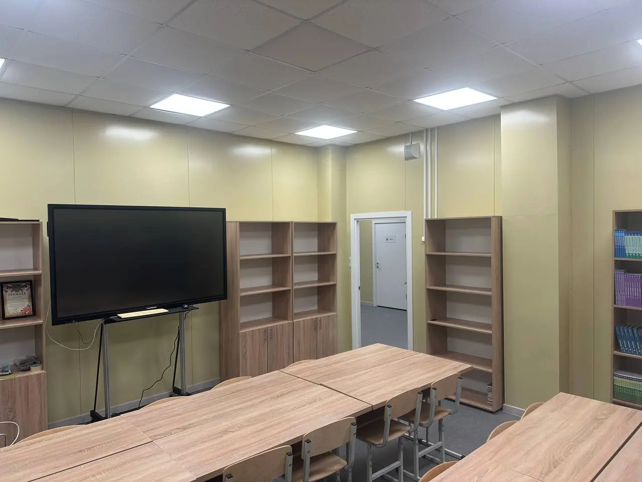 Classroom with an interactive display and cabinets